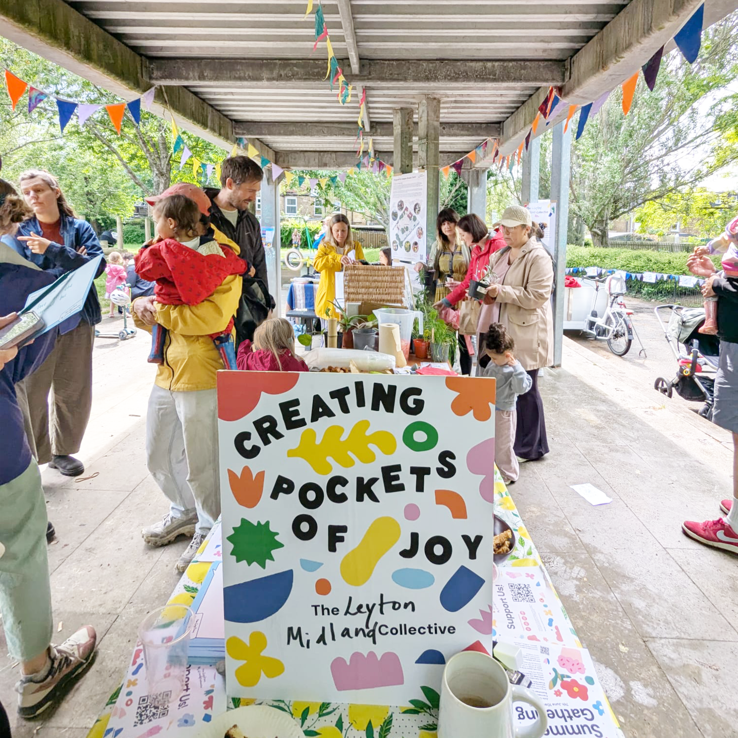 LMC Summer Gathering - a table, bunting, colour, people, families